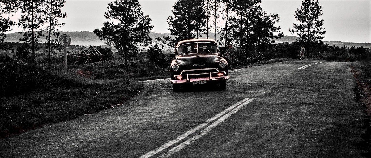 Classic-Car-Taxi-driving-on-a-runway-in-Cuba