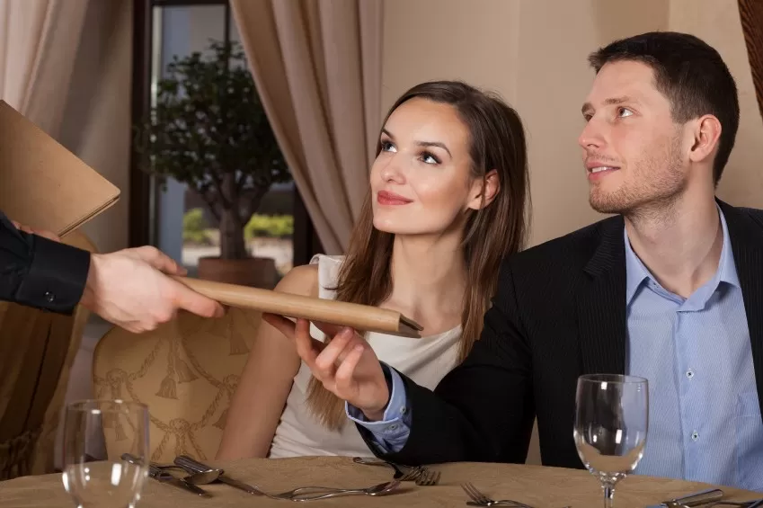 Waiter giving menu